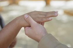 two people holding hands; how marriage can affect disability benefits