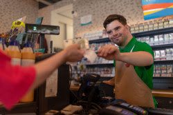 A cashier checking out a customer.