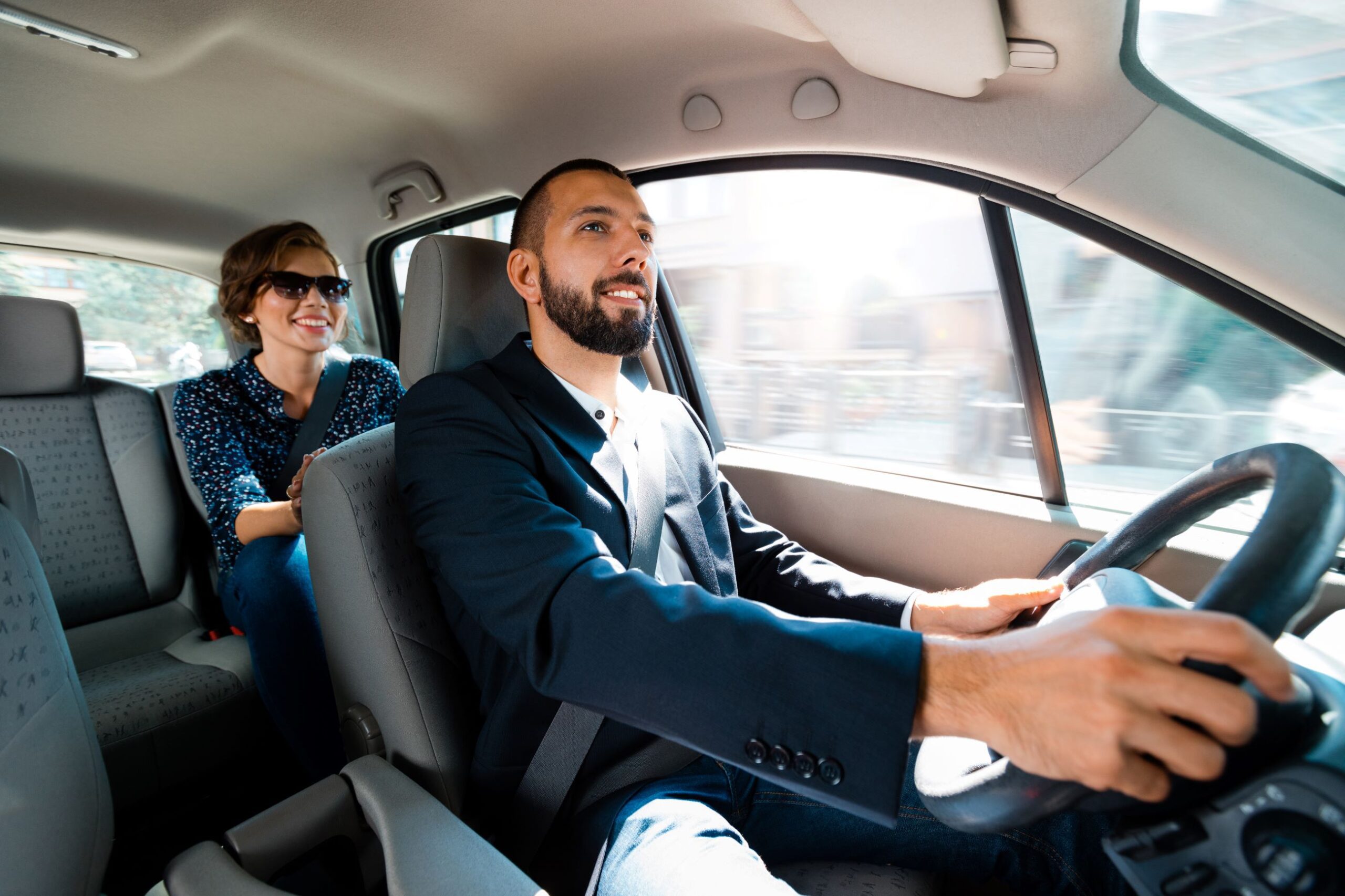 A rideshare driver with a passenger. Rideshare accessibility